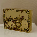 Rectangular 100g soap bar with embedded lavender buds on a neutral background