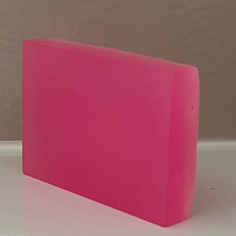 Pink soap bar on a gray background