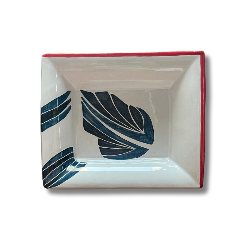 Hand-painted ceramic change tray featuring  blue leaf designs inspired by the Drifting Leaves pattern