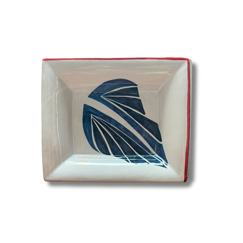 Hand-painted ceramic change tray featuring a blue leaf design inspired by the Drifting Leaves pattern